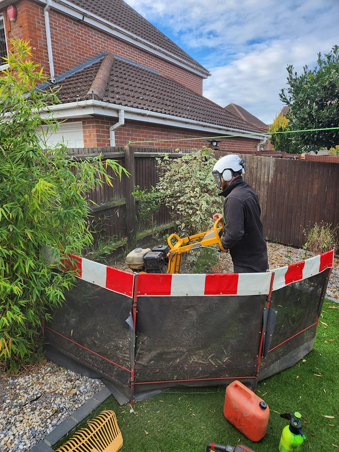 Stump grinding with protective boarding