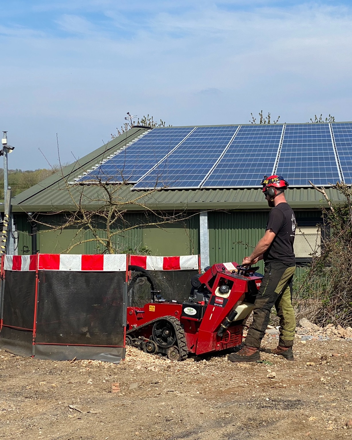 Stump grinding on business grounds